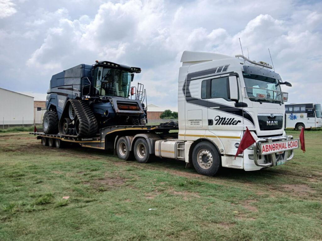 Abnormal load transport with warning sign