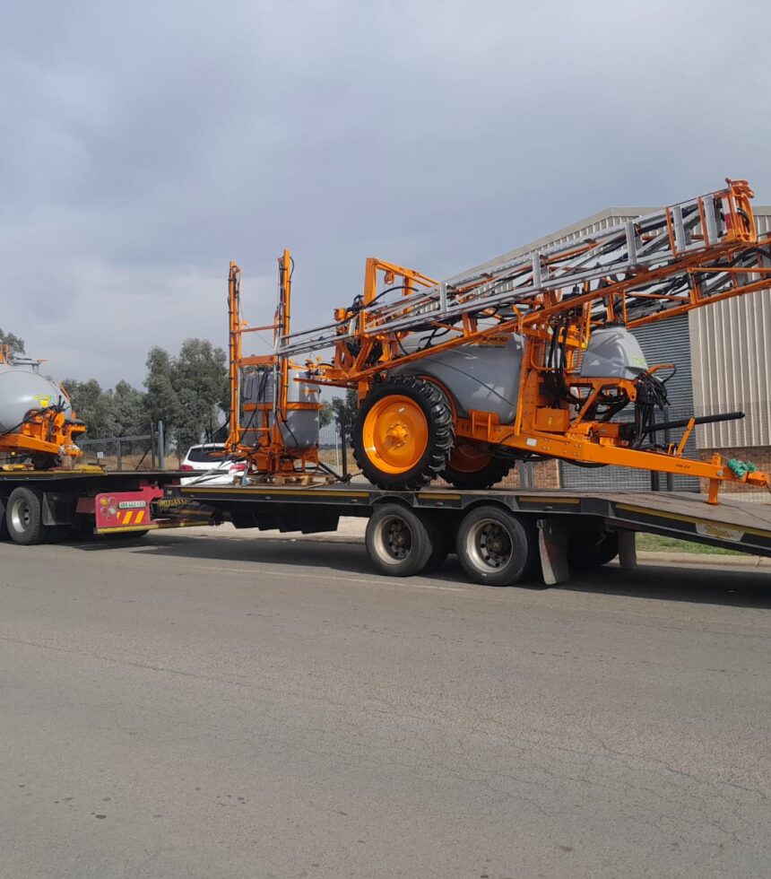 Crane truck lifting agricultural implement